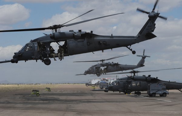 US troops onboard Air Force HH-60 Pave Hawk helicopters leave to conduct a rescue operation during Exercise Angel Thunder, near the town of Bisbee in Arizona's Sonoran Desert on April 21, 2010. [Mark Ralston/AFP]