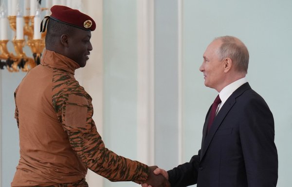 Russian President Vladimir Putin meets with Burkina Faso junta leader Capt. Ibrahim Traore outside St. Petersburg on July 29. Burkina Faso is one of six African countries to benefit from Russian 'grain aid'. [Alexey Danichev/Pool/AFP]
